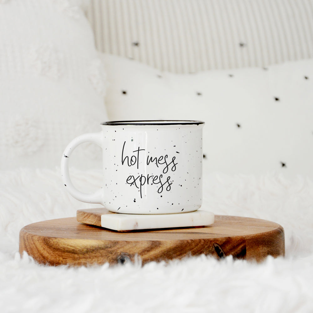 Hot Mess Express oversized campfire mug with black rim, featuring double-sided design and white sesame glaze.