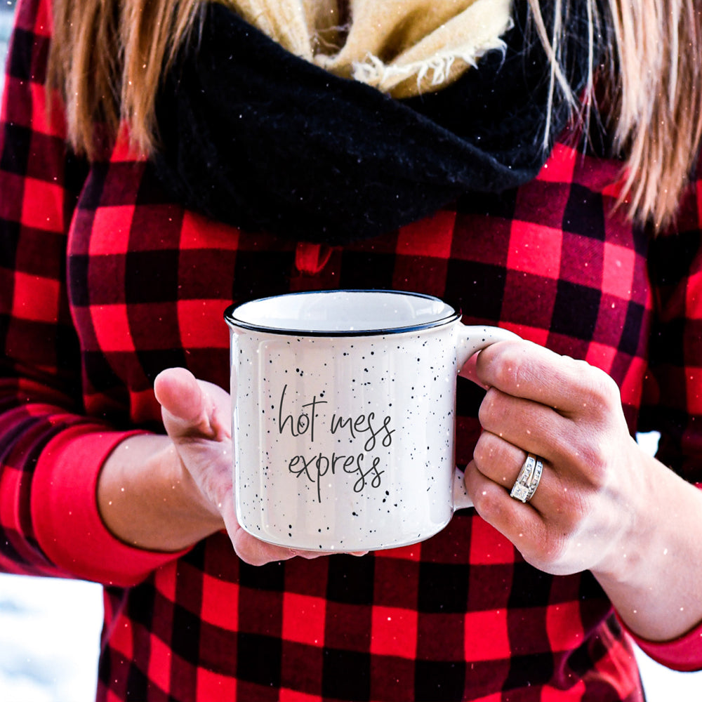 Hot Mess Express oversized campfire mug with black rim, featuring double-sided design and white sesame glaze.