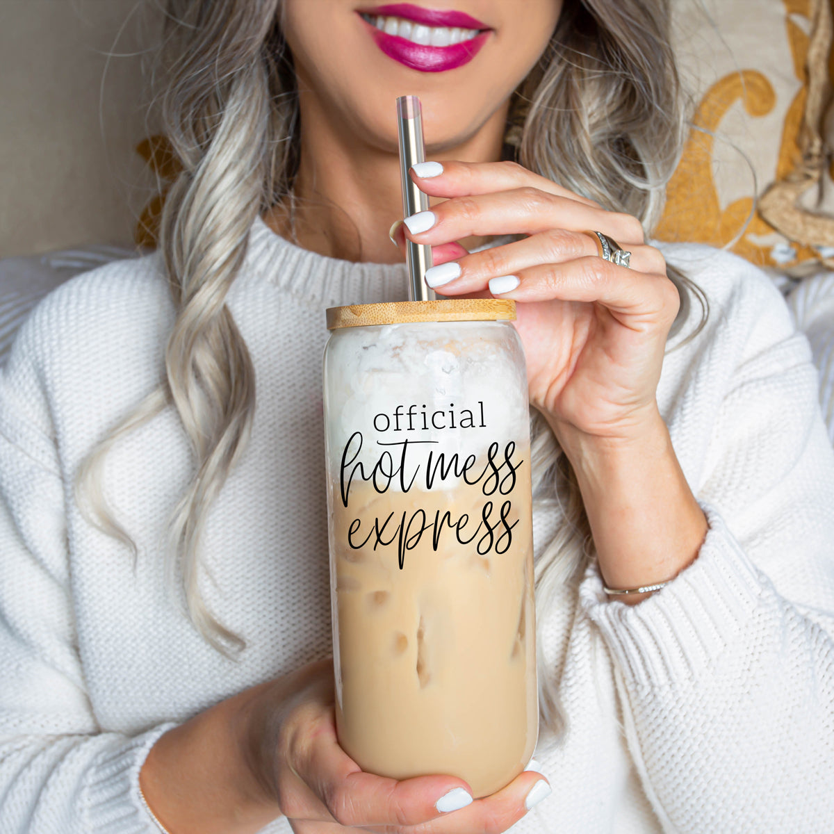 Hot Mess glass drinking cup with bamboo lid and stainless steel straws, showcasing a modern design and black graphic.