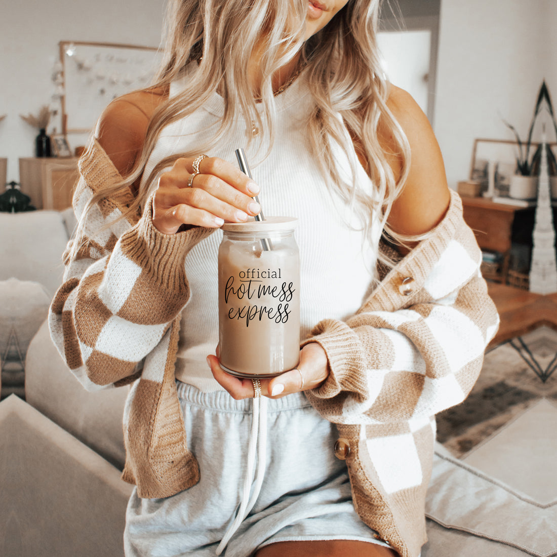 Hot Mess glass drinking cup with bamboo lid and stainless steel straws, showcasing a modern design and black graphic.