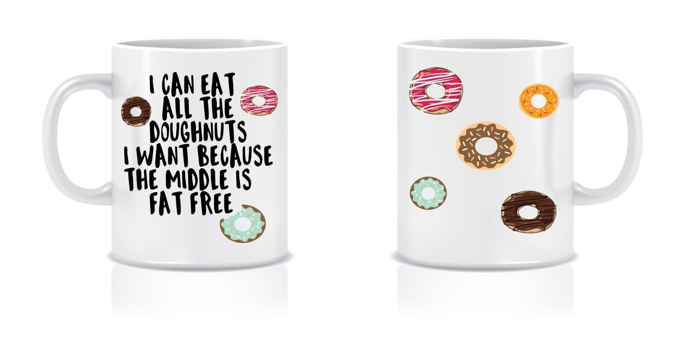 A glossy white ceramic mug with the phrase 'I Can Eat All The Doughnuts' printed on it, perfect for coffee or tea.