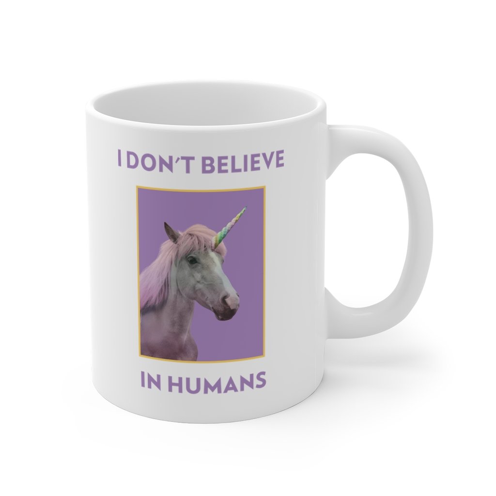 I Don't Believe in Humans Mug, white ceramic with a humorous slogan, perfect for coffee and tea.