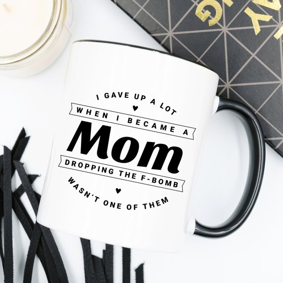 Funny coffee mug with the phrase 'Dropping The F Bomb Wasn't One Of Them', crafted from high-quality ceramic, perfect for moms.