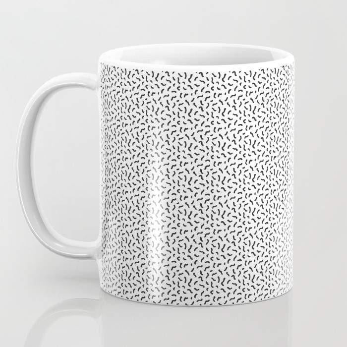 A humorous ceramic coffee mug with the phrase 'I Hate You the Least' printed in a playful font, featuring a wrap-around design and a large handle for easy gripping.