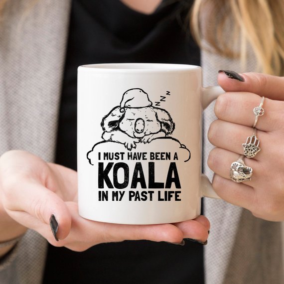 A humorous coffee mug featuring the phrase 'I Must Have Been A Koala In My Past Life', showcasing a playful design perfect for coffee lovers.