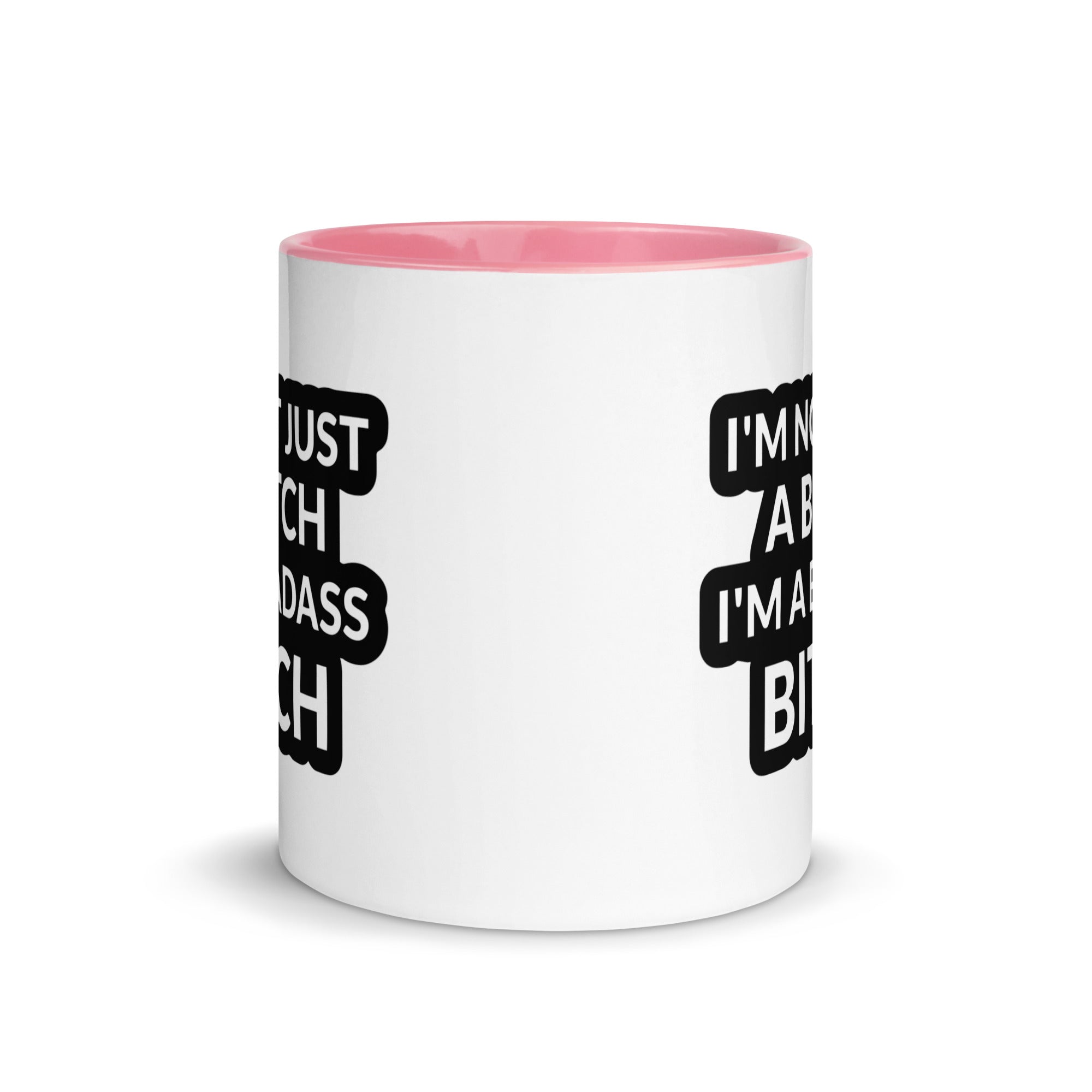 Ceramic mug with colorful rim and handle featuring the quote 'I'm Not Just A Bitch I'm A Bad Ass Bitch' in bold print.