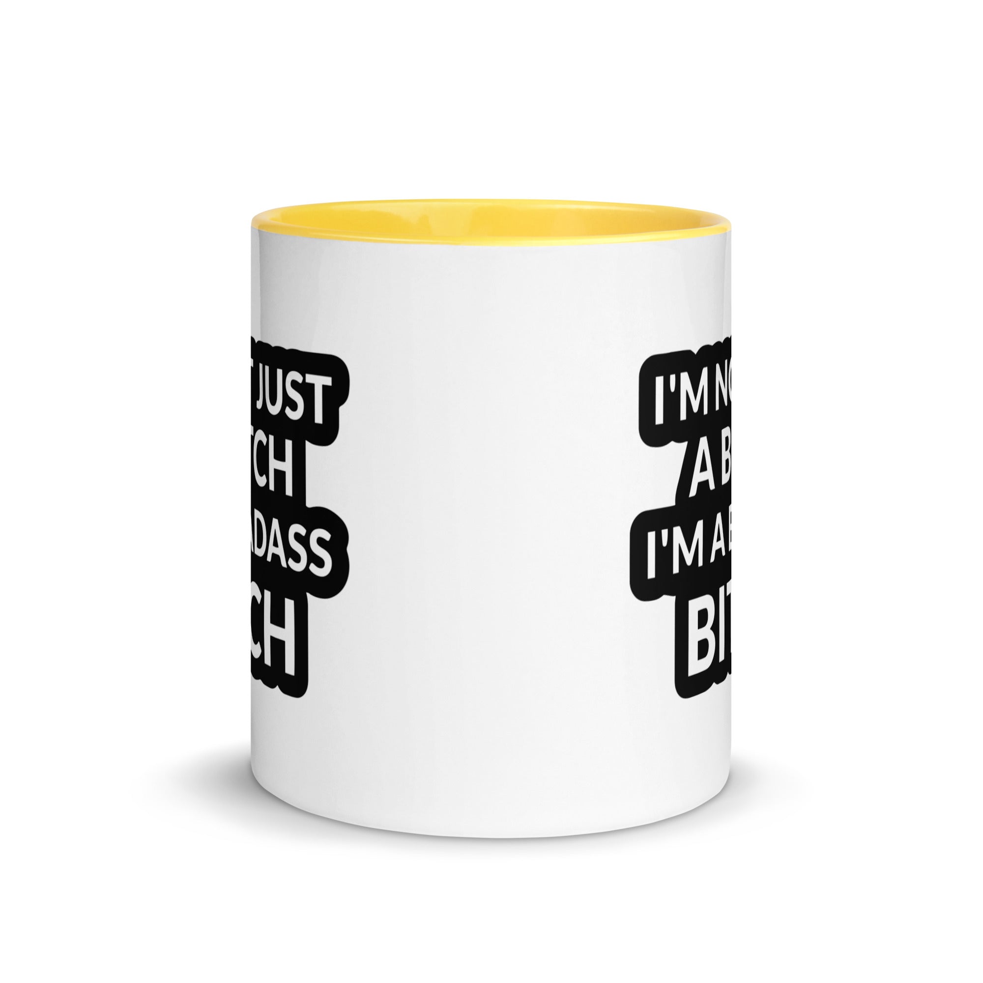 Ceramic mug with colorful rim and handle featuring the quote 'I'm Not Just A Bitch I'm A Bad Ass Bitch' in bold print.