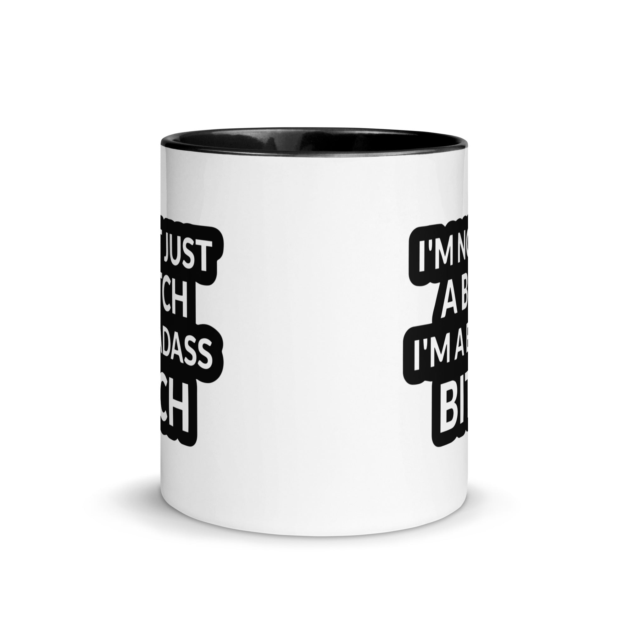 Ceramic mug with colorful rim and handle featuring the quote 'I'm Not Just A Bitch I'm A Bad Ass Bitch' in bold print.