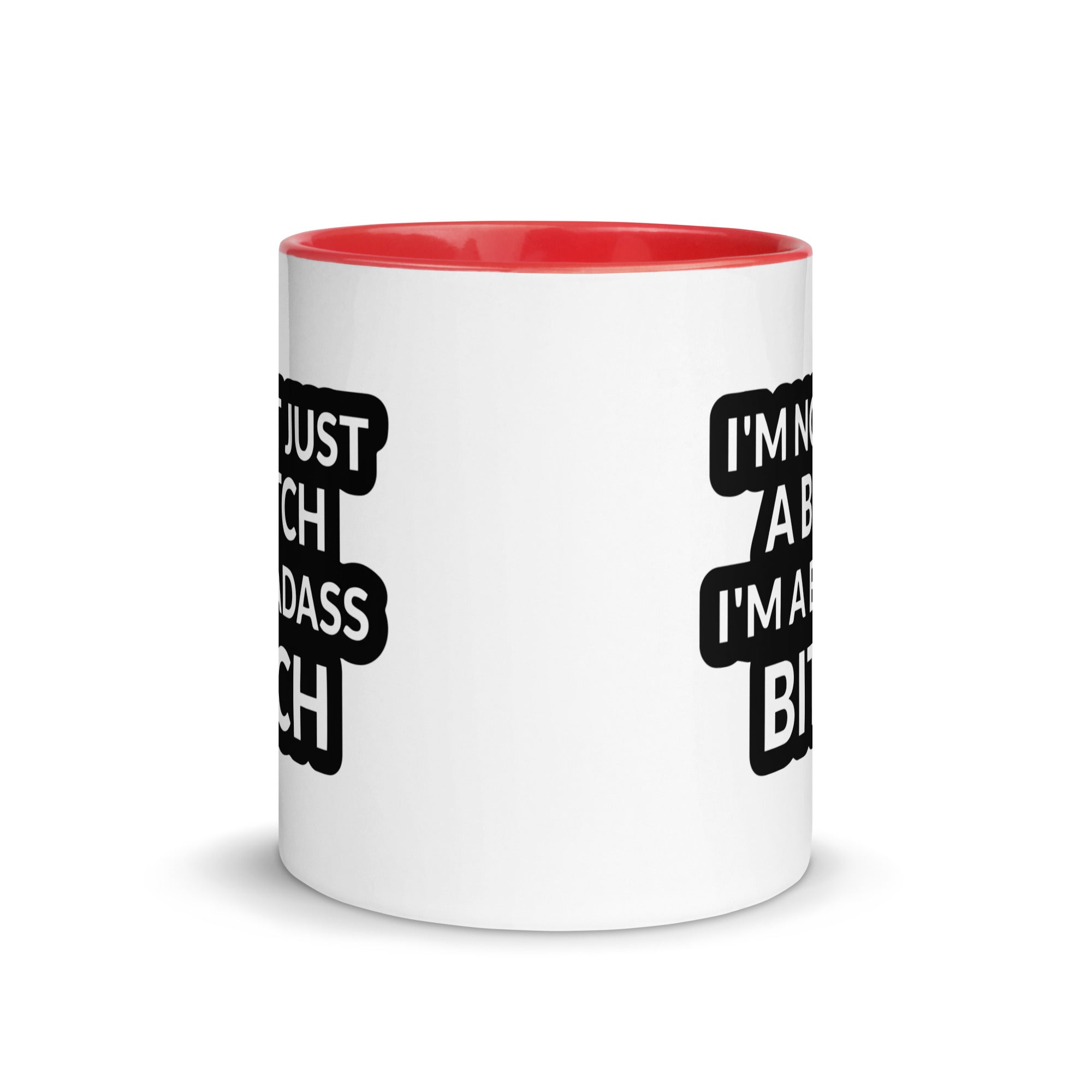 Ceramic mug with colorful rim and handle featuring the quote 'I'm Not Just A Bitch I'm A Bad Ass Bitch' in bold print.