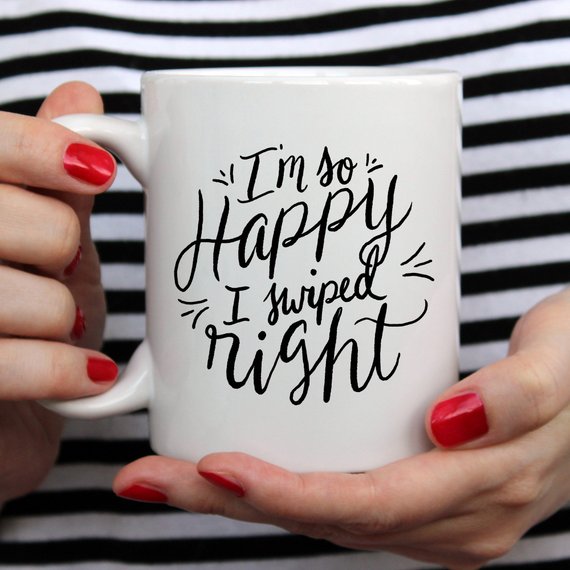 A humorous coffee mug with the phrase 'I'm So Happy I Swiped Right' printed on it, showcasing a fun design perfect for gifts.