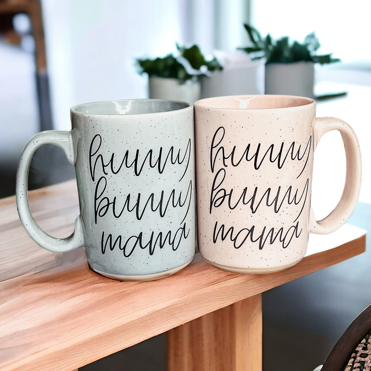 A collection of imperfect Easter mugs in pink and blue, showcasing unique designs and minor imperfections.