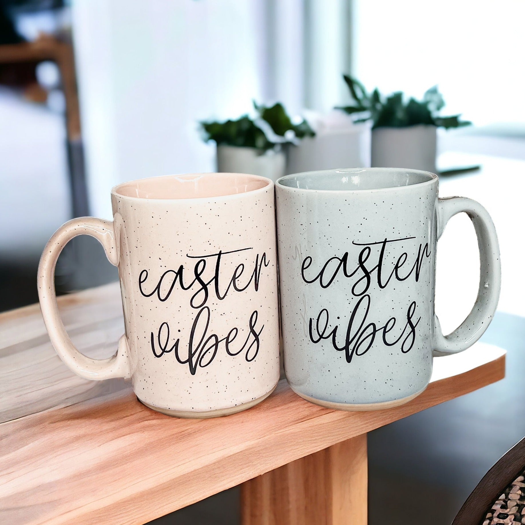 A collection of imperfect Easter mugs in pink and blue, showcasing unique designs and minor imperfections.