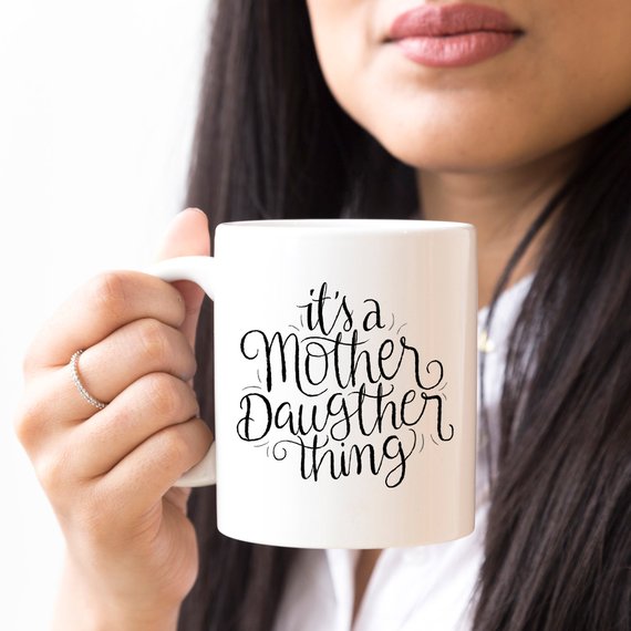 Funny coffee mug featuring a humorous design celebrating the mother-daughter relationship, made from high-quality ceramic.