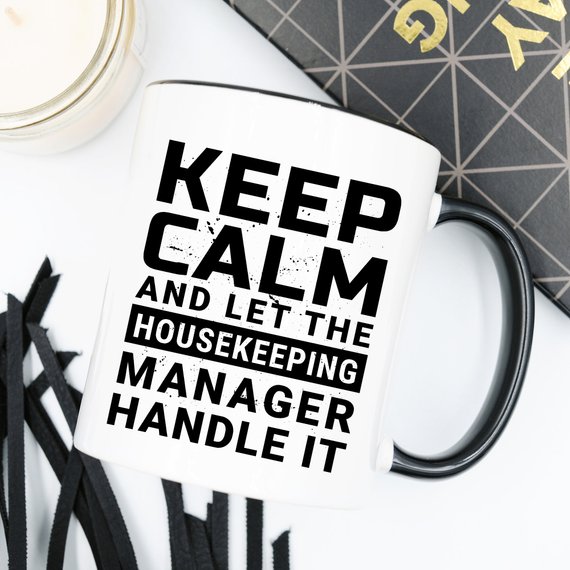 Funny coffee mug with 'Keep Calm And Let The Housekeeping Manager Handle It' design, crafted from high-quality ceramic.