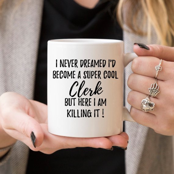 A stylish white ceramic Law Clerk Mug featuring a vibrant design printed on both sides, perfect for coffee or tea.