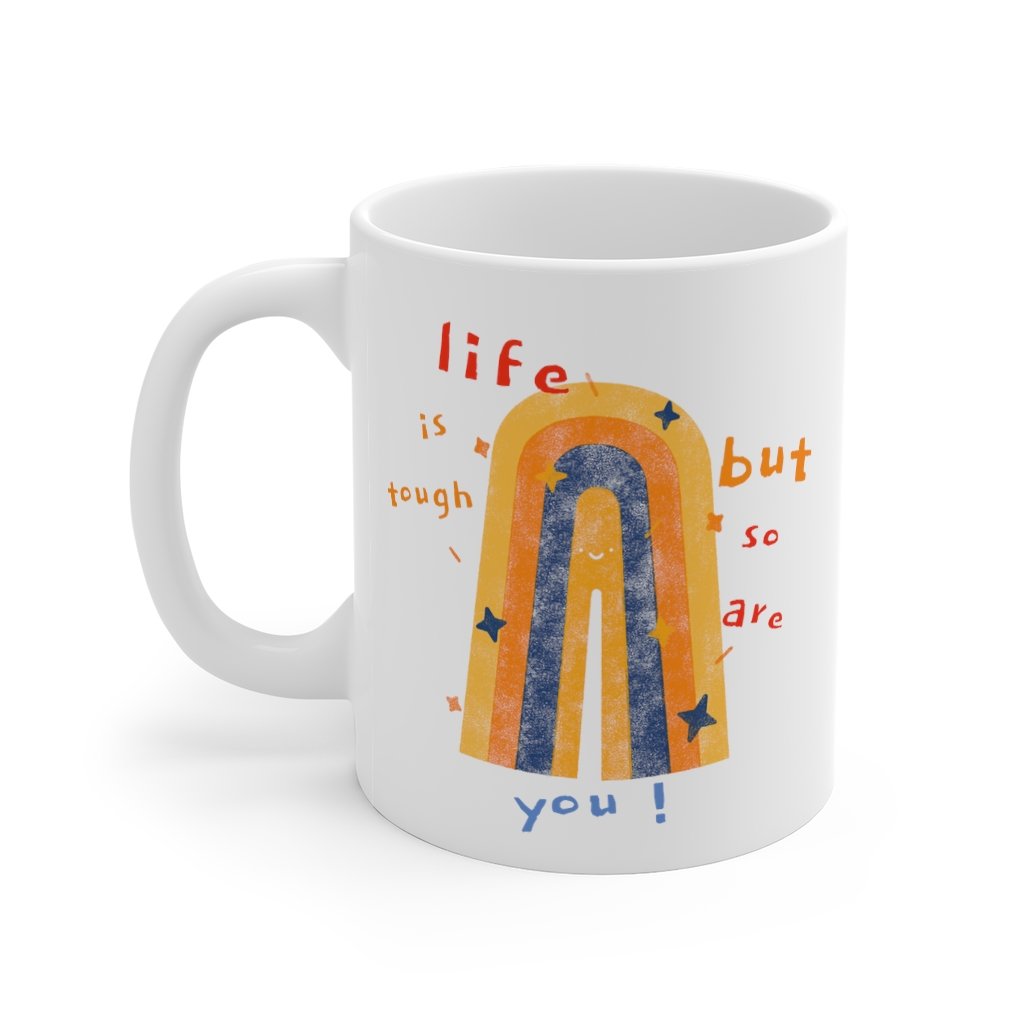 White ceramic coffee tea mug with inspirational text 'Life Is Tough, But So Are You', featuring a C-handle and rounded corners.