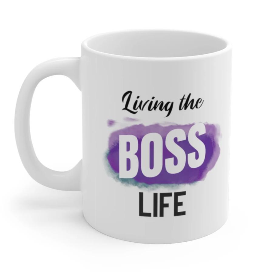 Living A Boss Life Mug made of white ceramic, featuring a motivational phrase and a comfortable C-handle.