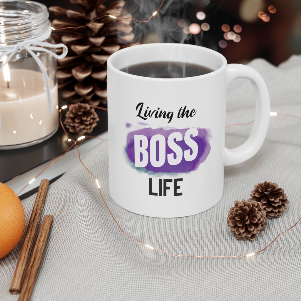 Living A Boss Life Mug made of white ceramic, featuring a motivational phrase and a comfortable C-handle.