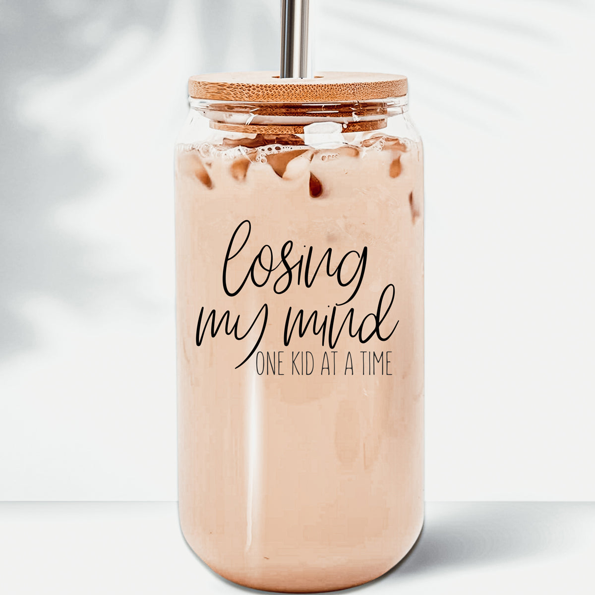 Losing My Mind Set glass drinking cups with bamboo lids and stainless steel straws, showcasing modern design and functionality.