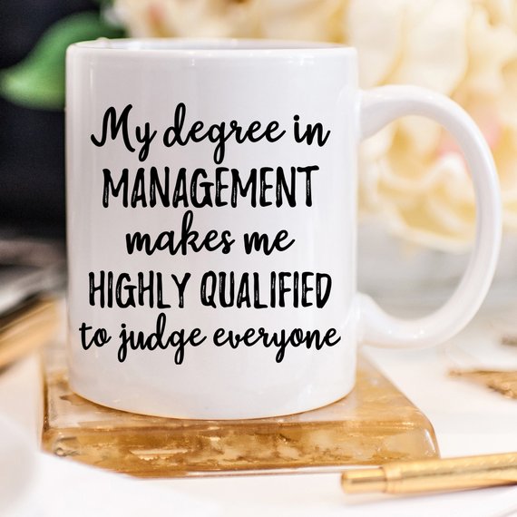 A stylish white Management Mug made from high-grade ceramic, featuring a vibrant design printed on both sides, perfect for managers.