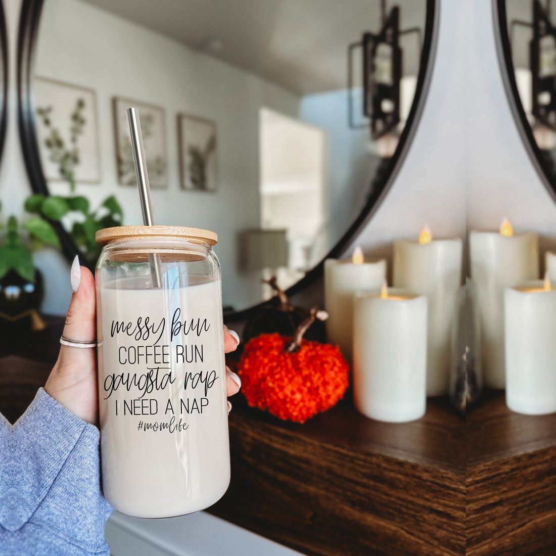 A stylish Messy Bun glass drinking cup with a bamboo lid and stainless steel straws, perfect for hot and cold beverages.