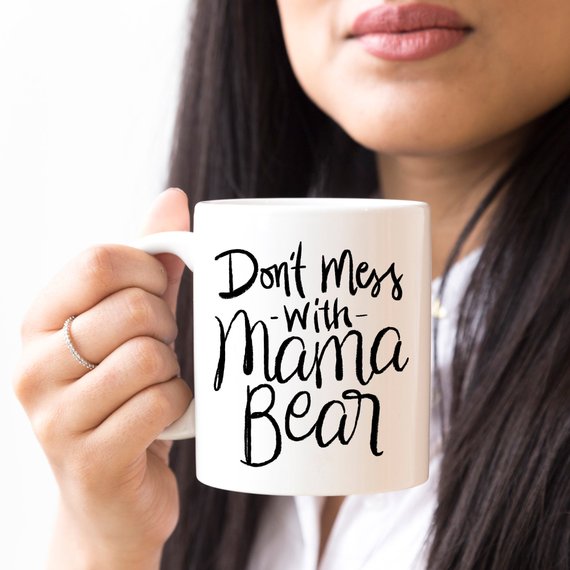 A humorous coffee mug featuring the phrase 'Don't Mess With Mama Bear', crafted from high-quality ceramic, perfect for moms.