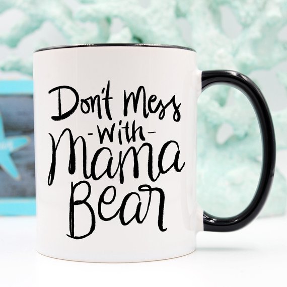 A humorous coffee mug featuring the phrase 'Don't Mess With Mama Bear', crafted from high-quality ceramic, perfect for moms.