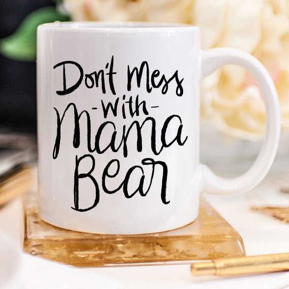 A humorous coffee mug featuring the phrase 'Don't Mess With Mama Bear', crafted from high-quality ceramic, perfect for moms.