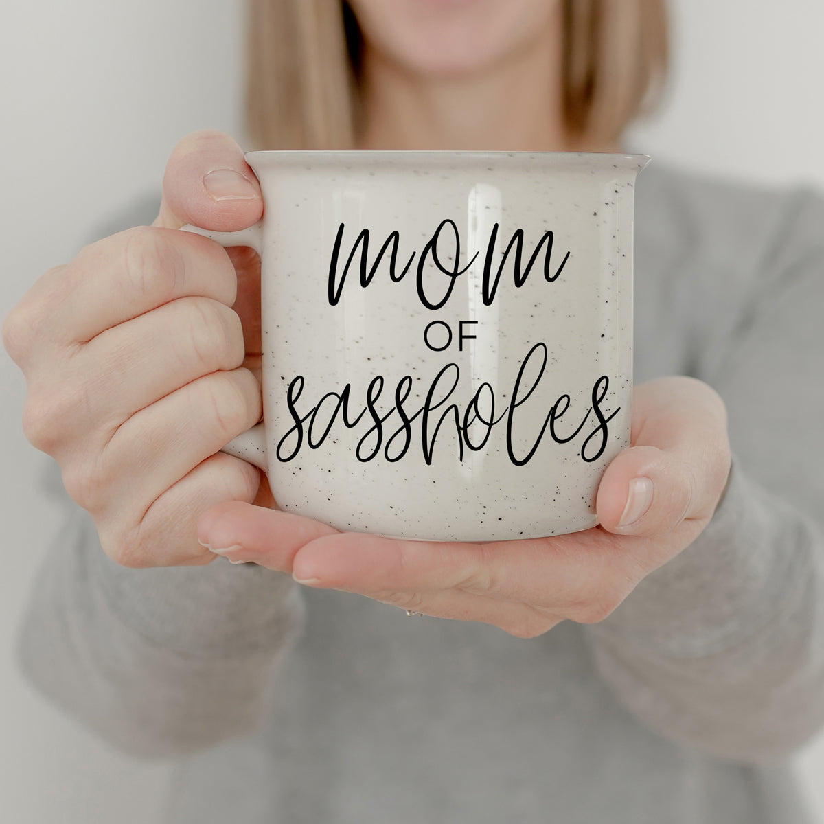 Mom of Sassholes 14.5oz ceramic campfire mug with white sesame glaze and black lettering, designed for sassy moms.