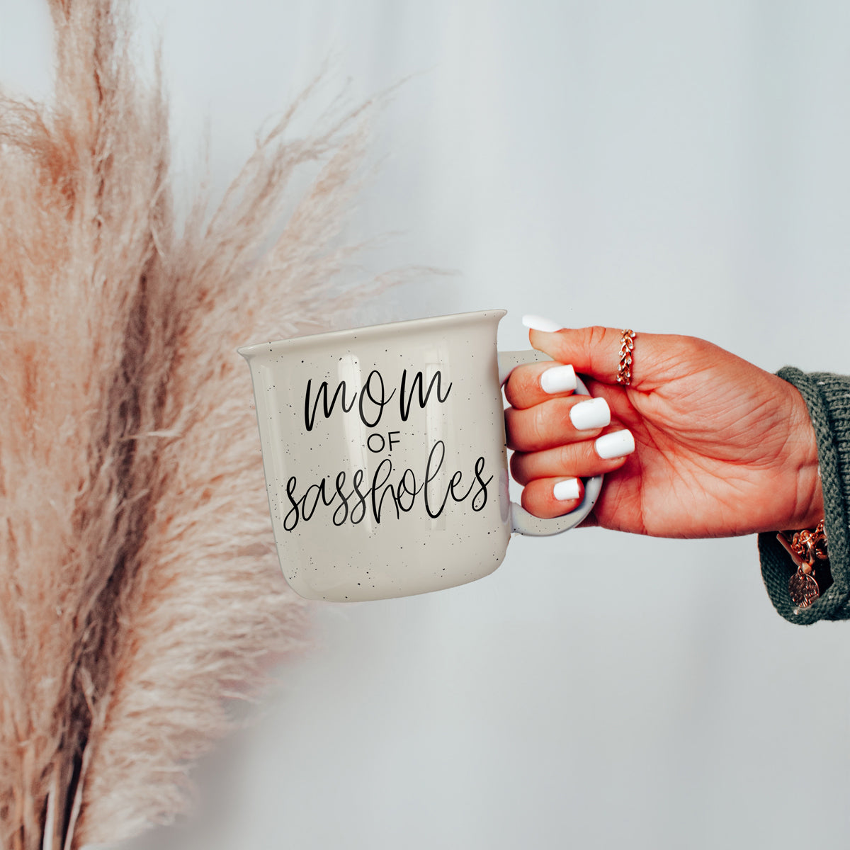 Mom of Sassholes 14.5oz ceramic campfire mug with white sesame glaze and black lettering, designed for sassy moms.