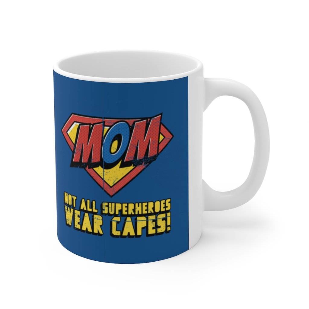 A white ceramic mug featuring the phrase 'Not All Superheroes Wear Capes' with a superhero theme, perfect for coffee or tea.