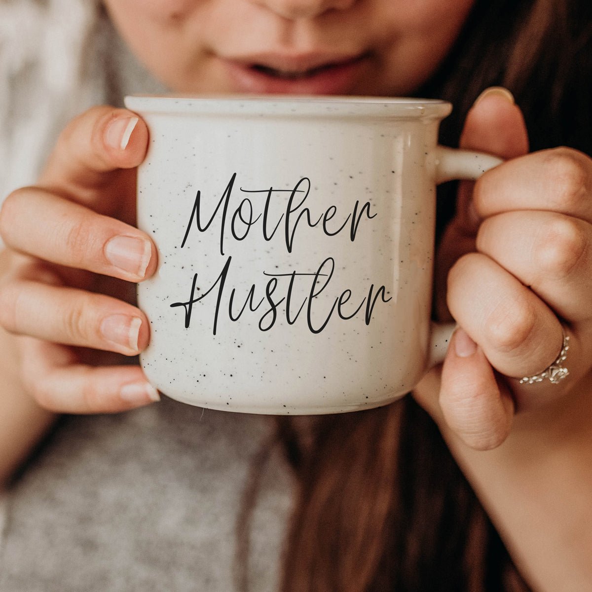 Mother Hustler 14.5oz ceramic campfire mug with white sesame glaze and black lettering, designed for busy moms.