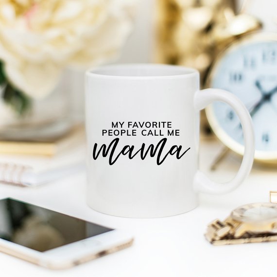 A humorous coffee mug with the phrase 'My Favorite People Call Me Mama' printed on it, showcasing a fun design perfect for Mother's Day.