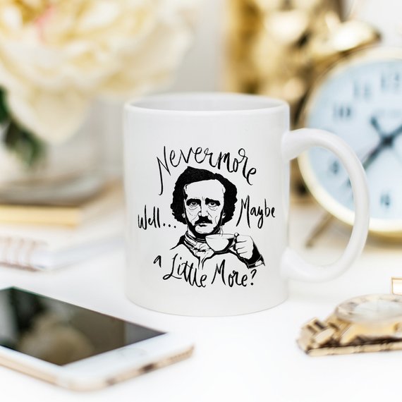 A high-quality 11 oz ceramic coffee mug featuring the phrase 'Nevermore' in a stylish design, perfect for Edgar Allan Poe fans.