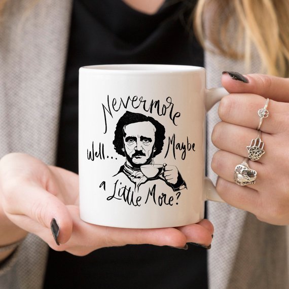 A high-quality 11 oz ceramic coffee mug featuring the phrase 'Nevermore' in a stylish design, perfect for Edgar Allan Poe fans.