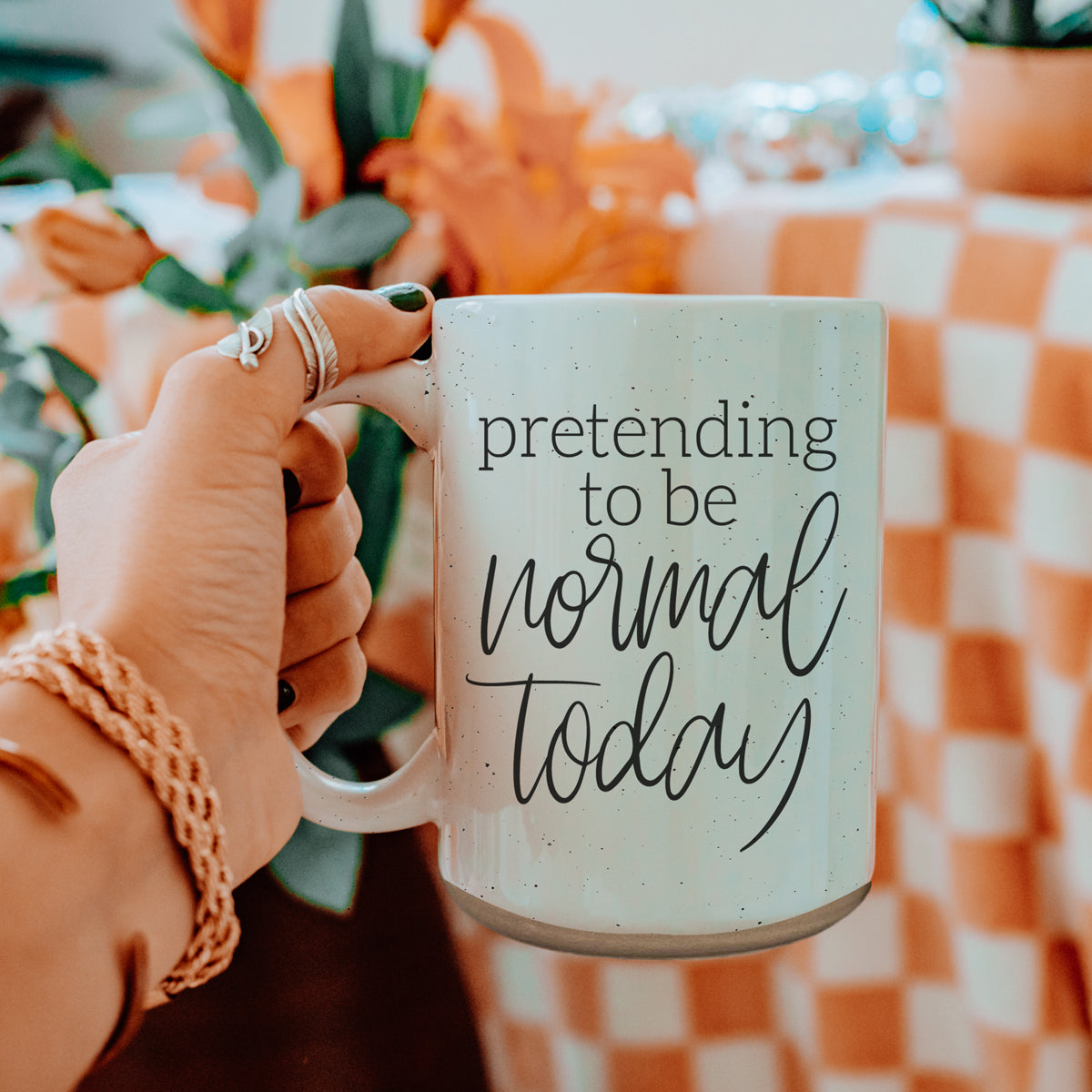 A 16oz off-white ceramic mug with dark speckles, featuring the humorous text 'Pretending to be Normal Today' on both sides.