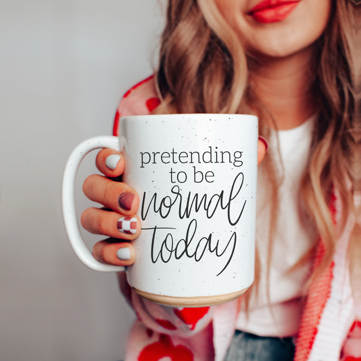 A 16oz off-white ceramic mug with dark speckles, featuring the humorous text 'Pretending to be Normal Today' on both sides.