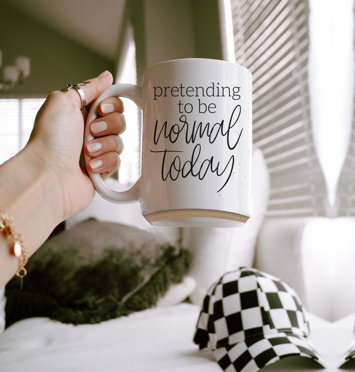 A 16oz off-white ceramic mug with dark speckles, featuring the humorous text 'Pretending to be Normal Today' on both sides.