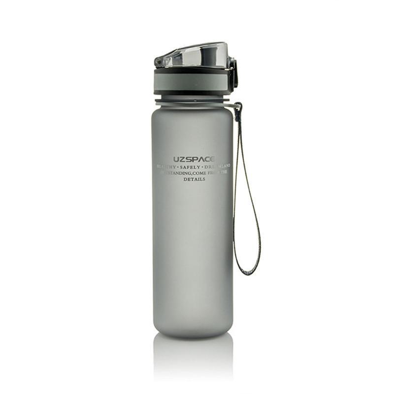 A portable leak-proof sports water bottle with a cylindrical shape, designed for outdoor travel, featuring a sleek plain pattern and a 500ml capacity.