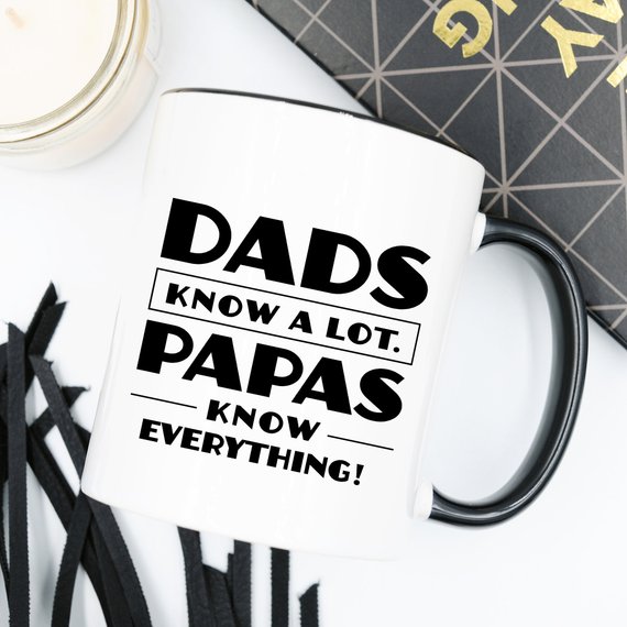 Funny coffee mug with the phrase 'Dads Know A Lot, Papas Know Everything' printed on it, showcasing a humorous design perfect for gifting.