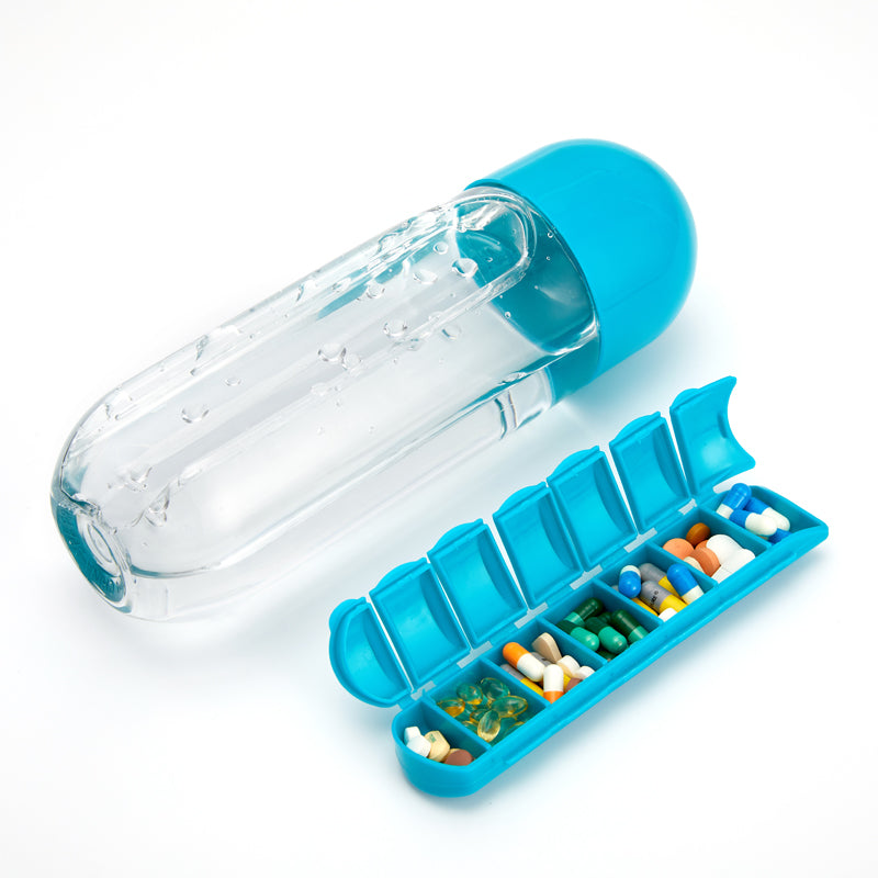 A clear plastic drink bottle with a built-in medicine pills box, featuring seven compartments for pills, ideal for outdoor activities.