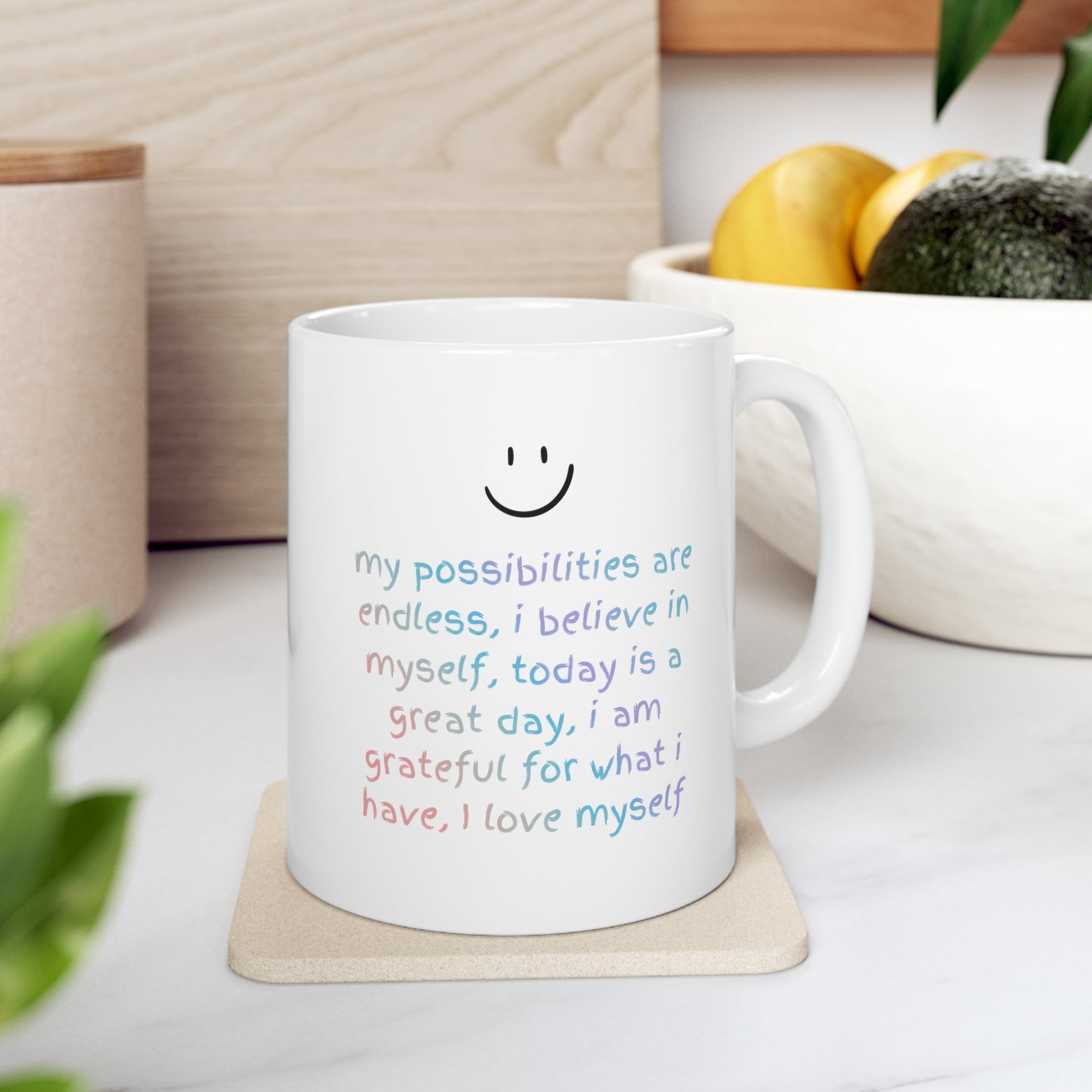 A white ceramic mug with positive affirmations, perfect for coffee or tea, featuring rounded corners and a classic design.