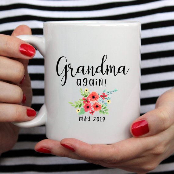 White ceramic mug with 'Grandma Again' design printed on both sides, perfect for pregnancy announcements.