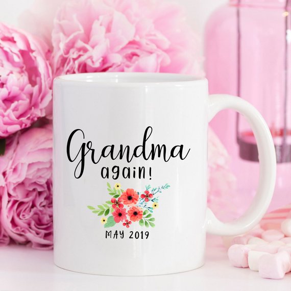 White ceramic mug with 'Grandma Again' design printed on both sides, perfect for pregnancy announcements.