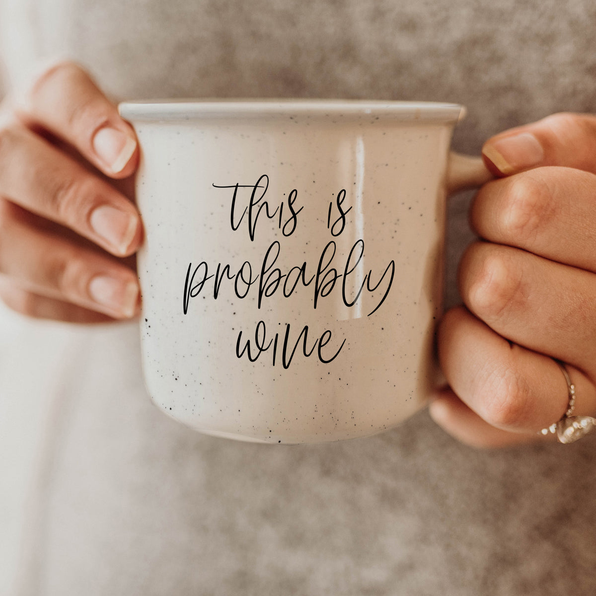 Probably Wine 14.5oz ceramic mug with light ivory glaze and black lettering, featuring a campfire style design.