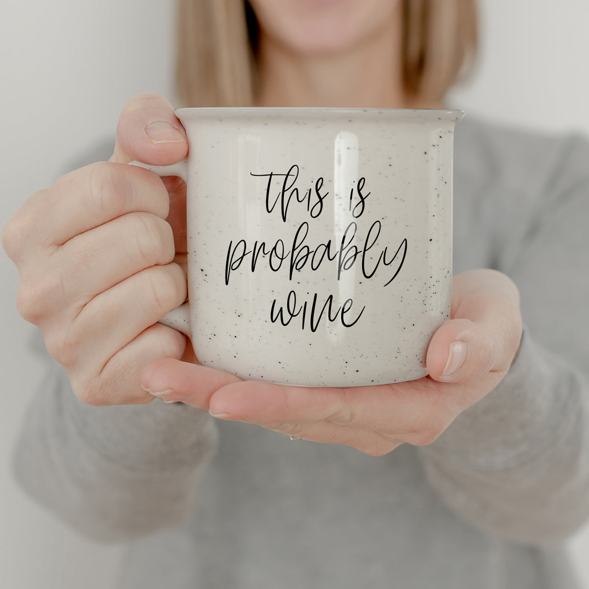 Probably Wine 14.5oz ceramic mug with light ivory glaze and black lettering, featuring a campfire style design.