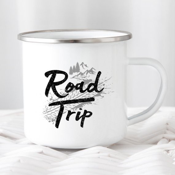 A white enamel camping mug with a stainless steel rim, featuring a vibrant road trip design printed on both sides, perfect for outdoor adventures.