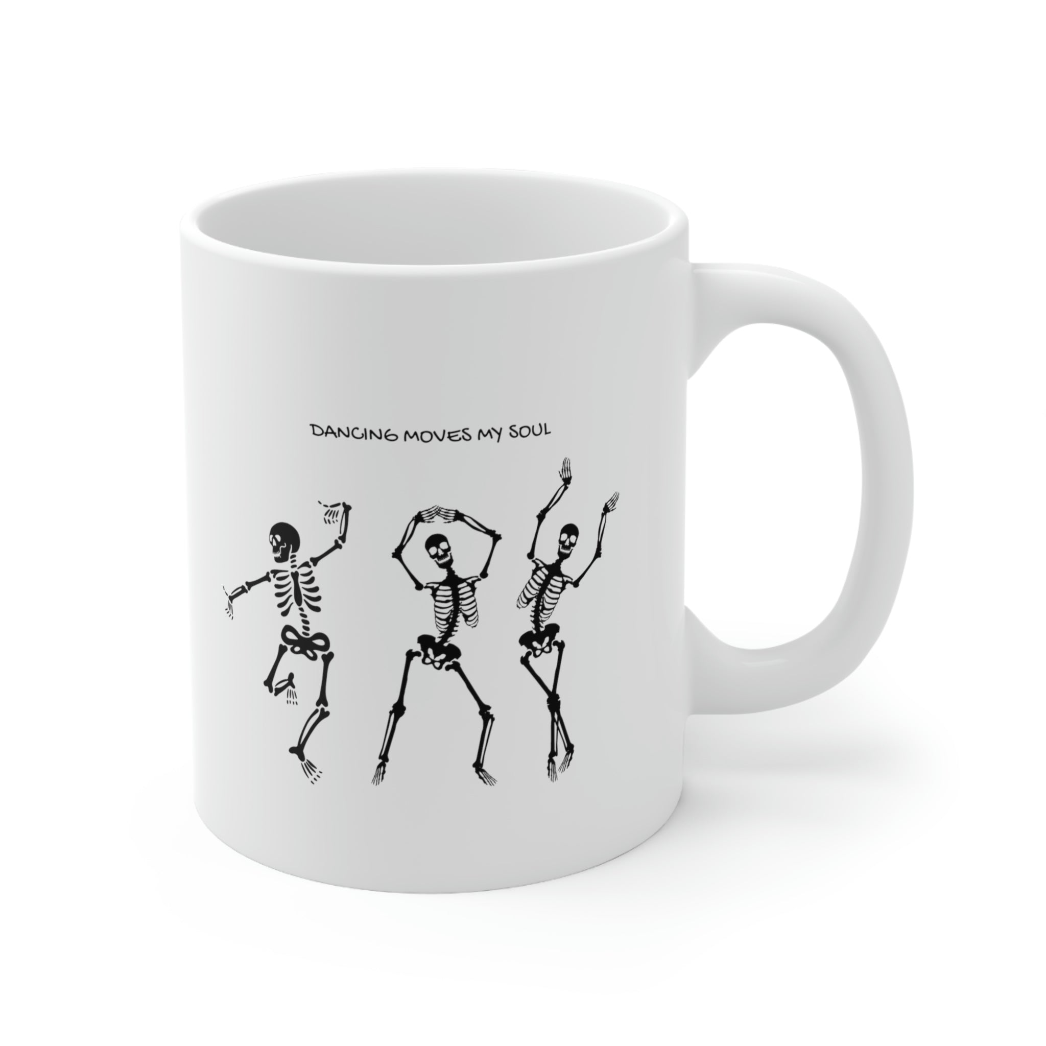 A white ceramic mug featuring a playful design of dancing skeletons, perfect for coffee and tea lovers.