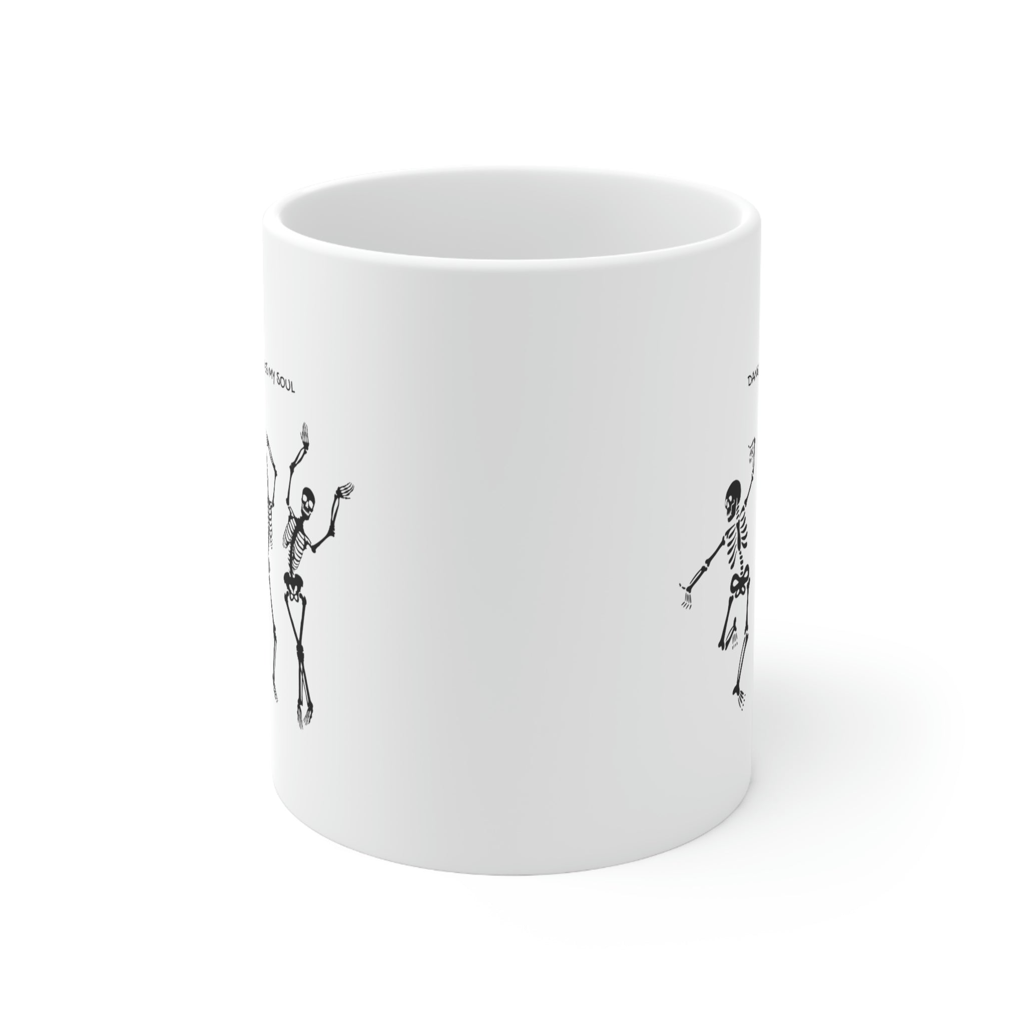 A white ceramic mug featuring a playful design of dancing skeletons, perfect for coffee and tea lovers.