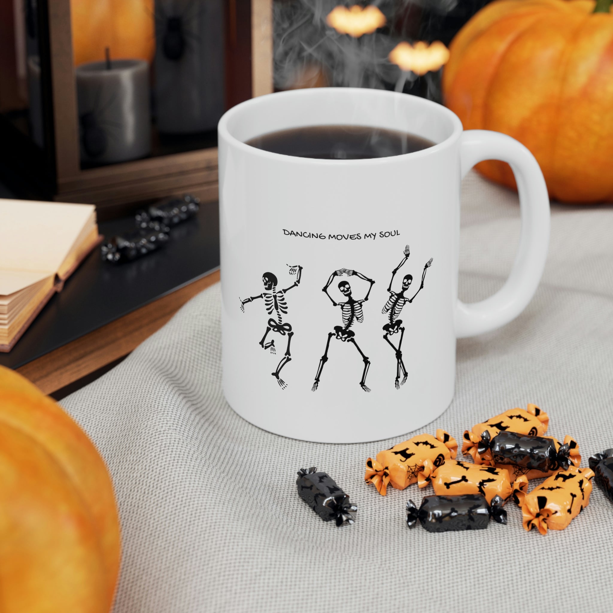 A white ceramic mug featuring a playful design of dancing skeletons, perfect for coffee and tea lovers.